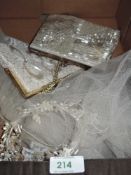 A vintage bridal veil and two beaded hand bags.