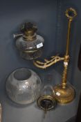 A Victorian students library or office oil burning lamp having ormolu decoration and cut glass well