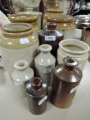 A collection of vintage earthen ware jars and bottles.