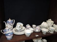 Two part tea services both having Japanese designs one having lithopane teacups and saucers