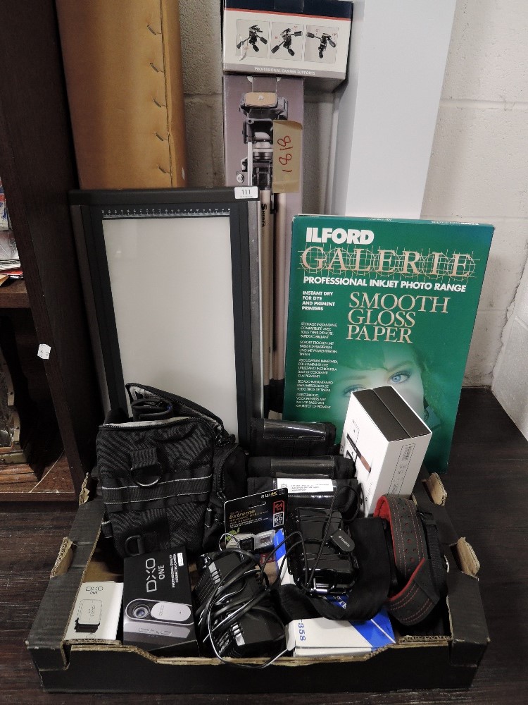 A good selection of digital film and camera equipment including tripods DXO one camera in box