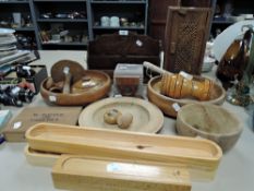 A mixed lot of tree including turned bowls, letter rack, egg cups and more.