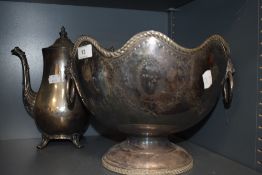 A large silver plated footed champagne or ice bucket by G H Hulley with twin lion head handles