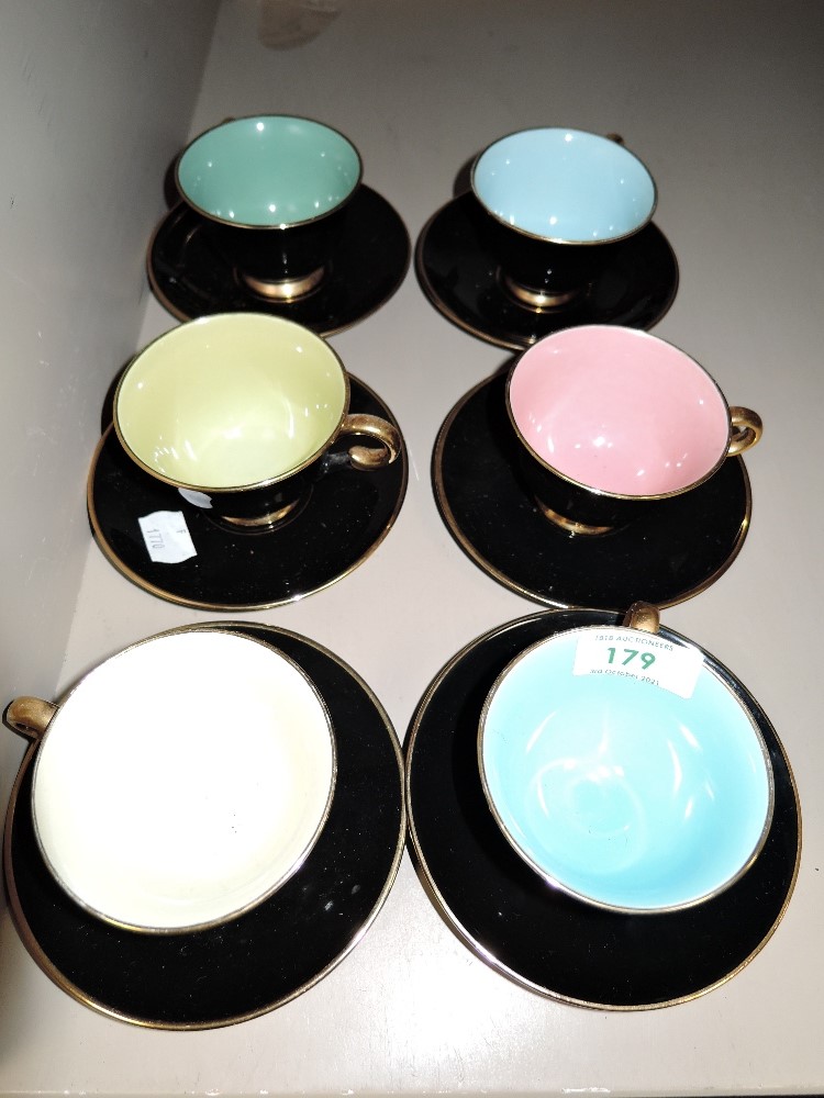 Six Harlequin tea cups and saucers marked underside Stavangerflint Norway.