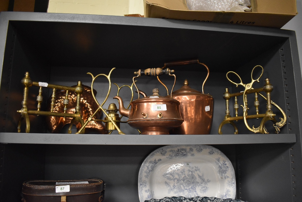 A good selection of antique fire side items including fire dogs, stove kettle and spirit burner with
