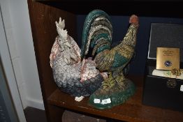 A cast iron cockerel or chicken door stop and similar life size figure