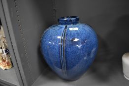 A large studio pottery vase Chinese of pot form having blue drip glaze 35cm tall by 25cm wide approx