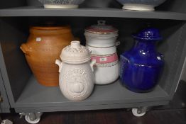 A selection of large ceramic buscuit jar and similar grain and flour containers