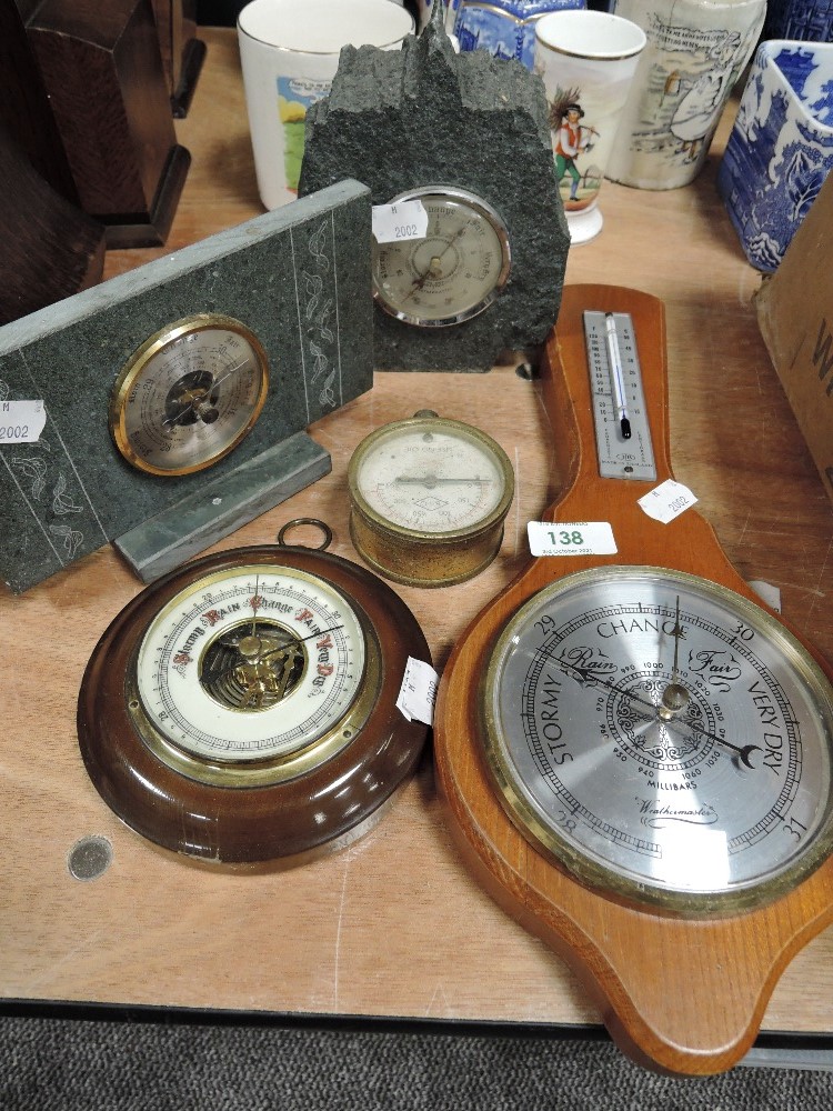 Four vintage barometers including slate mantel examples.