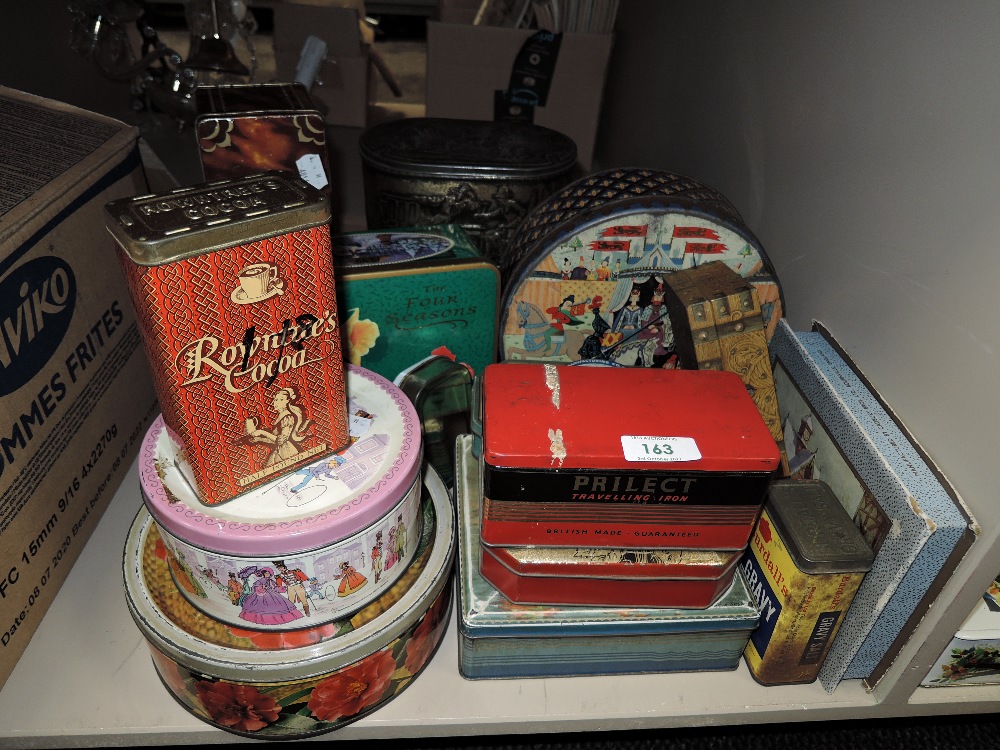 A collection of vintage advertising tins.