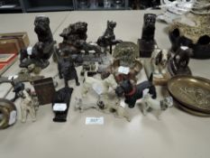 An interesting collection of vintage spelter, brass, wood and similar dog related figurines and