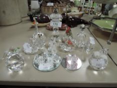 A collection of crystal animals and figurines.