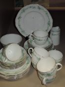 A selection of Wellington china having green transfer pattern with gilt detailing.