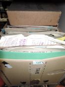 A box full of vintage sheet music.