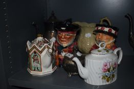 A selection of tea pots and two character jugs by Shorter and sons