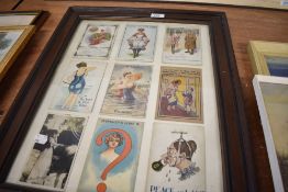 Set of nine vintage framed postcards.