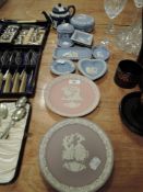 A mixture of Wedgwood, plates, tea pot and more.