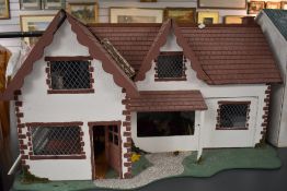 A large collection of hand made wooden Doll's Houses, part built and in parts along with a large