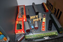 A shelf of Hornby and similar 00 gauge including 0-4-0 BR Loco, Diesel Loco D6830, Car Transporter