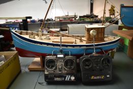 A hand built radio controlled wooden scale model Boat having brass propeller and rudder, on wooden