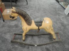 A possible reproduction wooden Rocking Horse having carved mane, leather saddle with one stirup, mi