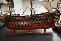 A scratch built wooden model, HMS Victory, fully rigged, on wood plinth, Height 75cm, length 100cm