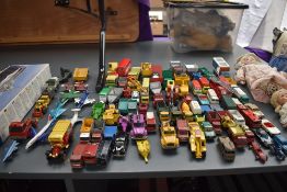 A collection of Matchbox and similar playworn diecasts, cars, construction vehicles aeroplanes etc