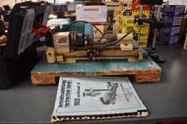 A Emco Unimat 3 Lathe with instruction booklet and clamp