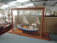 A modern wooden model Sail Boat Norden T78 in glass case, overall dimensions of case height 36cm,