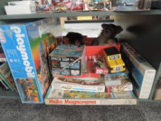 A shelf of mixed vintage Toys and Games including Playmobil Magic Dragon's Temple in original box