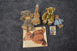 Two modern Steiff Bears, Lizzy the Cat with yellow tag 2728/17 and Grey Bear with open mouth and