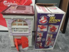 A 1980's Kenner Ghostbusters Fire Station Headquarters having ghost pursuit fire pole, ghost