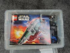 A box containing Lego Star Wars Slave 1 Set 75060 with the instruction booklet present, vendor