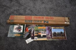 Two boxes of Peco Streamline N and 00 track along with Hornby, Airfix, Didcot Railway booklets etc