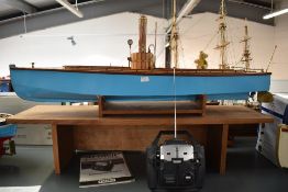 A wooden hand built radio controlled Live Steam Boat having copper and brass boiler, on wood