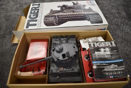 A Tamiya plastic 1/16 scale model radio controlled German Tiger I Tank, numbered S33, controller and