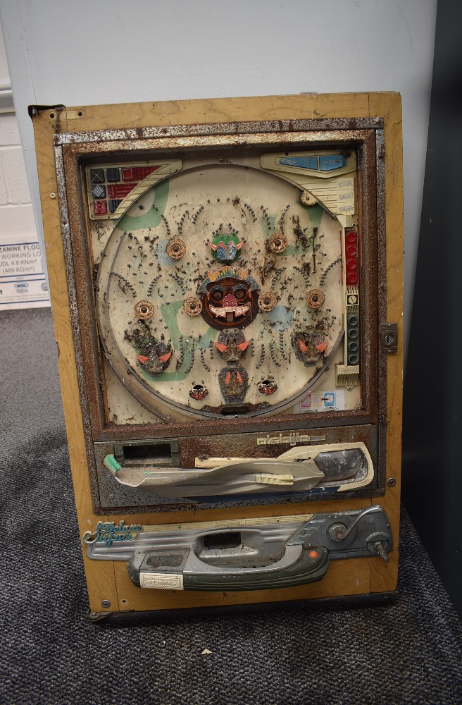 A Nishijin Japanese Pachinko Pinball Machine, missing back and glass front, width 52cm