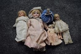 Four early 20th century and later dolls, Armand Marseille Alma numbered 9/0, length 30cm, three