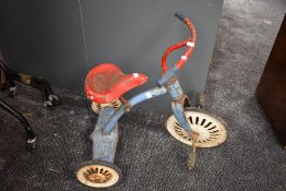 A vintage metal Child's Trike having spoke wheels and rubber tyres