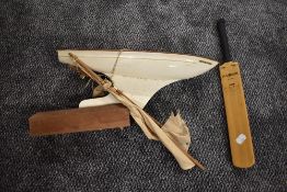 A Star pond Yacht Endeavour III with sail on wood stand and a miniature Cricket Bat bearing