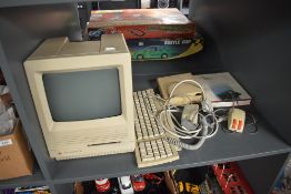 A Apple Macintosh SE/30 Home Computer model no M5119 with mouse, power supply and reference book