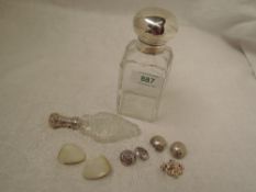 A Victorian glass bottle of rectangular form having glass stopper and silver hinged lid,