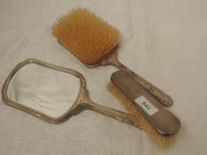 A silver three piece dressing table set having engine turned decoration, Birmingham 1940, Gieves