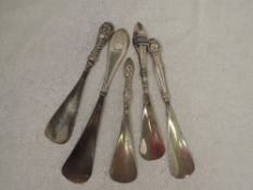 Five HM silver handled shoe horns of various forms