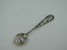 An Alexander Ritchie Iona silver tea spoon having moulded leaf decoration to terminal and Dove of