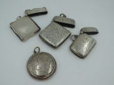 Three HM silver vestas of various forms including plain with moulded rim, and an HM silver