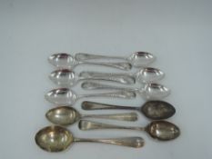 A set of six Edwardian silver egg spoons having engraved decoration to stems and plain cartouches,