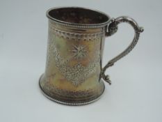 A Victorian silver Christening mug of tapered form having engraved floral swag decoration and