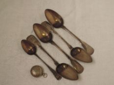 Four Georgian silver dessert spoons of fiddle back pattern bearing monogram to terminals, London