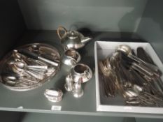 A selection of silver plate including table lighter, three piece tea set, circular gallery tray,